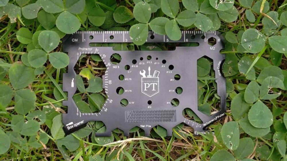 The credit card multitool 3 laying in the grass, a great EDC multitool